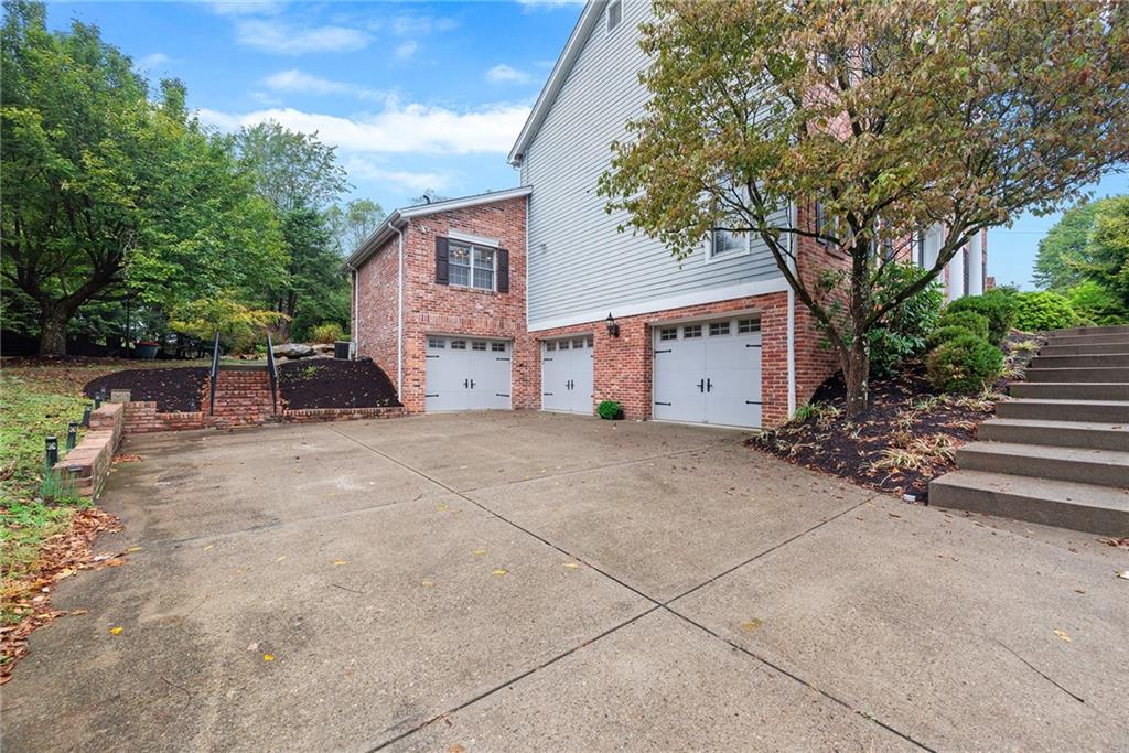 2779 Clearview Road Allison Park, PA 15101 - Photo 40 of 49 Three-car garage configuration with an oversized two-car garage, separate one-car garage and expansive driveway.