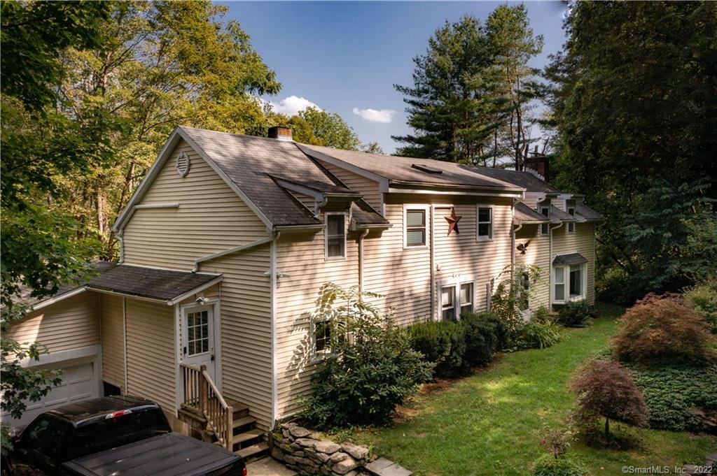 229 West Cornwall Road Sharon, CT 06796 - Photo 1 of 1 a front view of a house with a yard