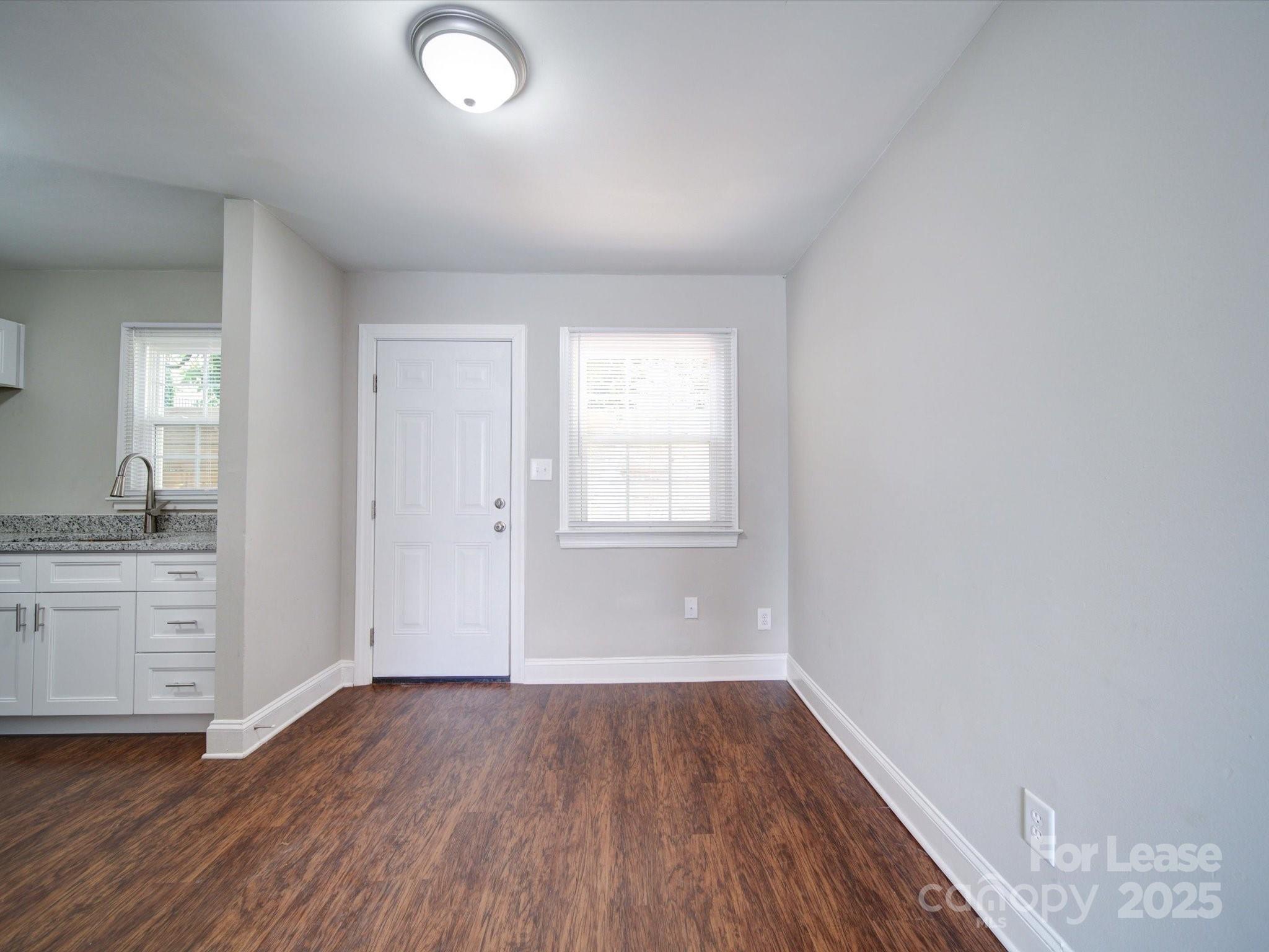 321 South Gardner Avenue, Unit 6 Charlotte, NC 28208 - Photo 11 of 35 wooden floor in an empty room with a window