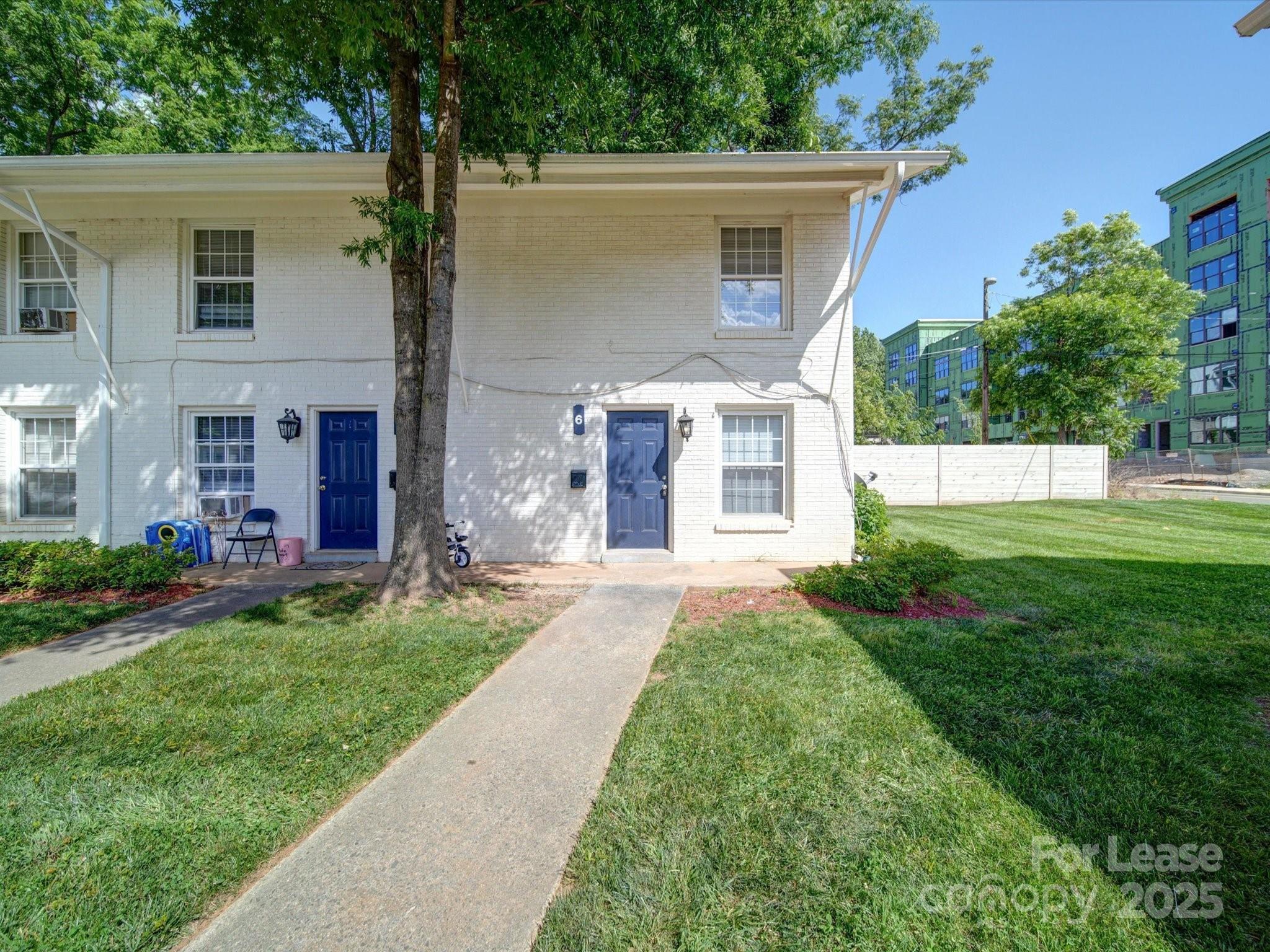 321 South Gardner Avenue, Unit 6 Charlotte, NC 28208 - Photo 2 of 35 front view of a house with a yard