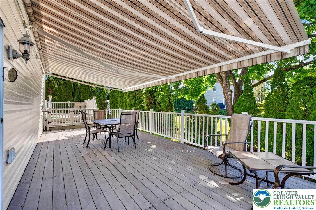 1702 Red Bud Road Quakertown, PA 18951 - Photo 58 of 68 An inviting deck offers generous outdoor living space with the comfort of a retractable awning.
