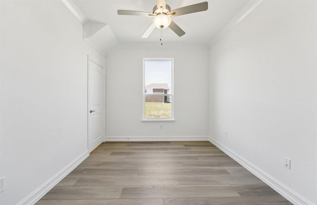 1616 Prosper Lane Anna, TX 75409 - Photo 2 of 12 wooden floor in an empty room with a window