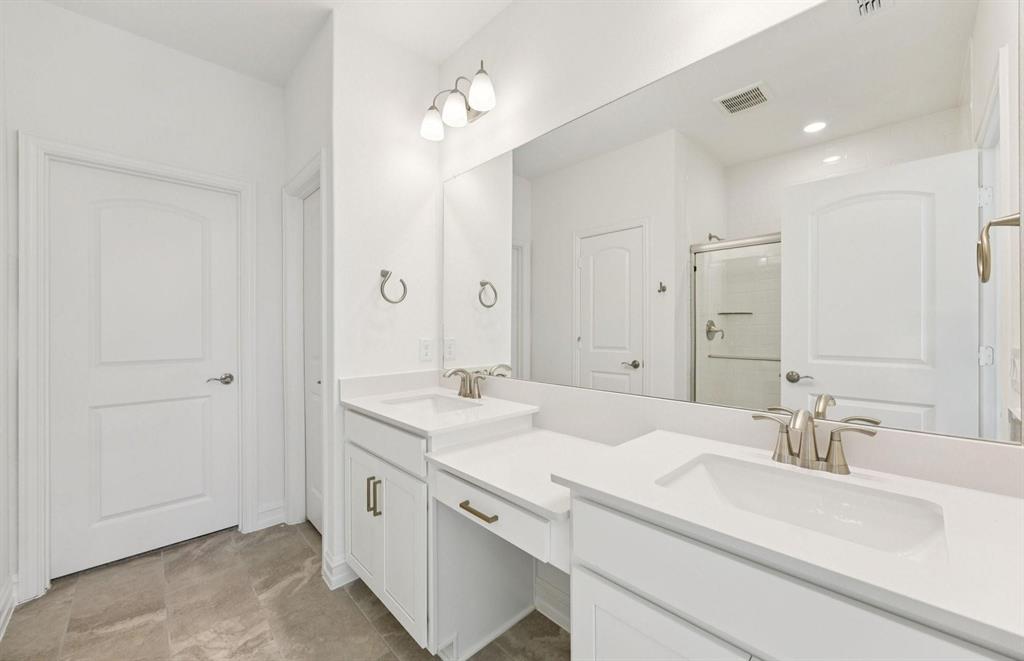 1616 Prosper Lane Anna, TX 75409 - Photo 6 of 12 a spacious bathroom with a double vanity sink and a mirror