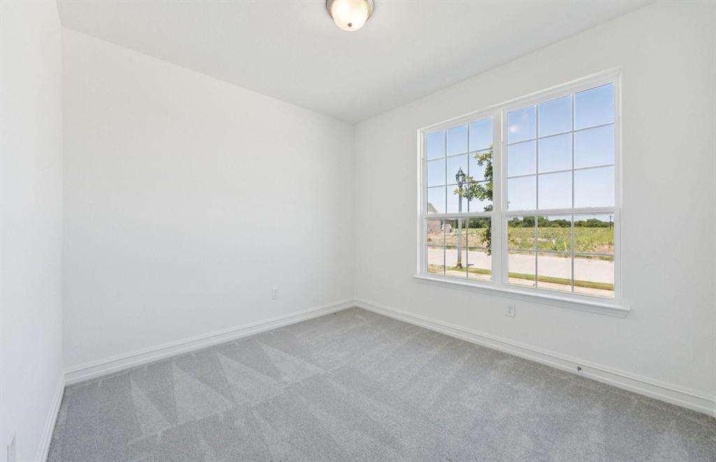 1616 Prosper Lane Anna, TX 75409 - Photo 8 of 12 an empty room with a window