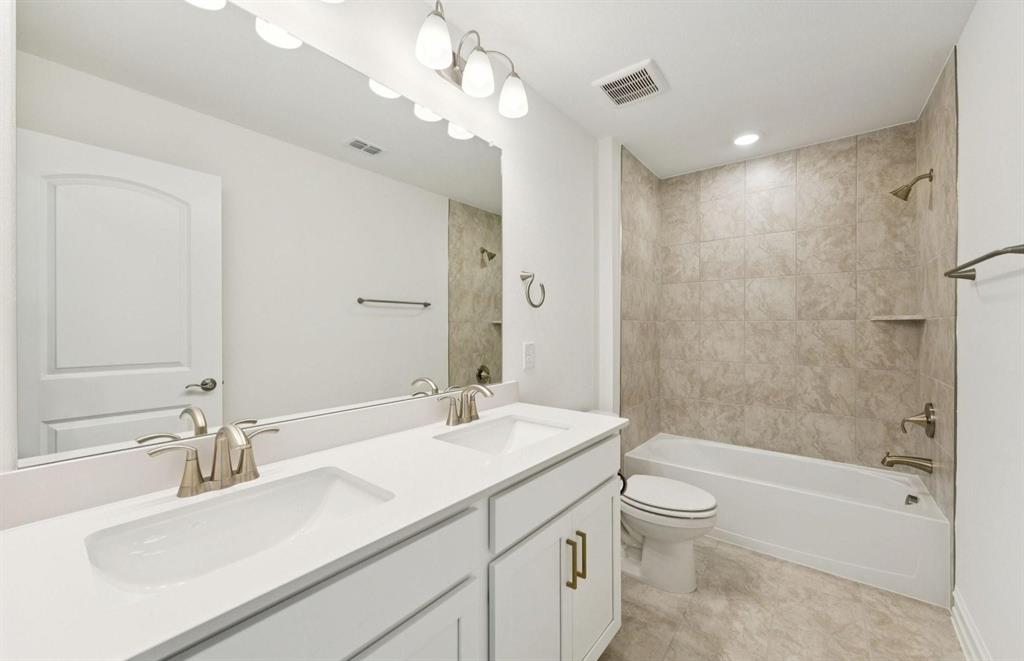 1616 Prosper Lane Anna, TX 75409 - Photo 10 of 12 a bathroom with a sink a toilet and shower