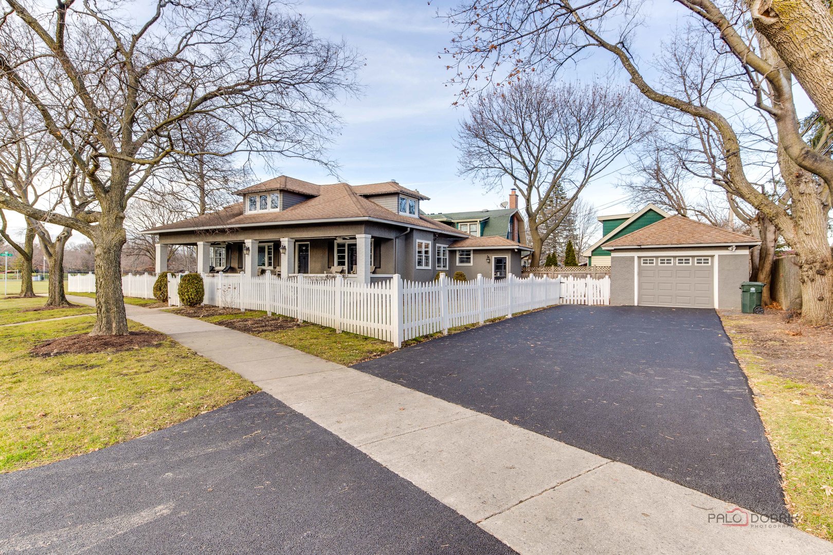 140 Summit Place Lake Forest, IL 60045 - Photo 2 of 39 a view of a house with large trees and a big yard