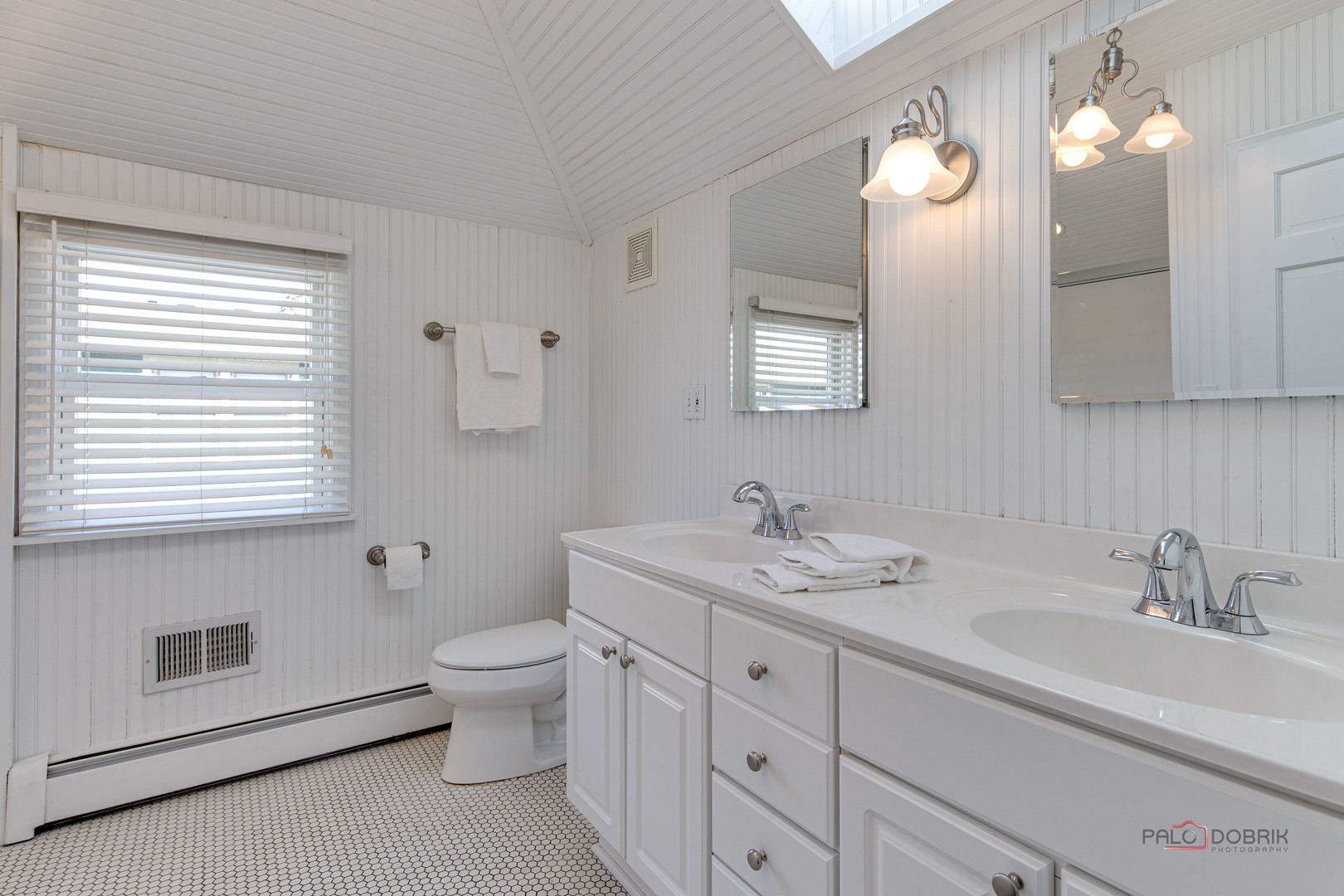 140 Summit Place Lake Forest, IL 60045 - Photo 23 of 39 a bathroom with a double vanity sink a toilet and a mirror