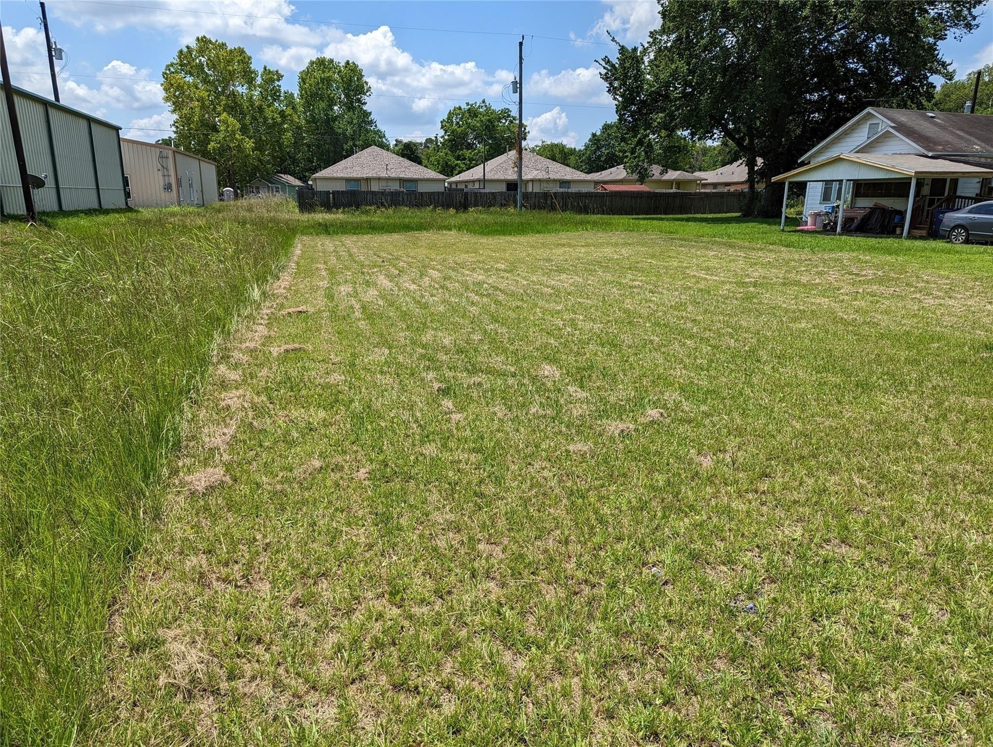 0 Mechanic Street Tomball, TX 77375 - Photo 2 of 4 a view of a house with a yard