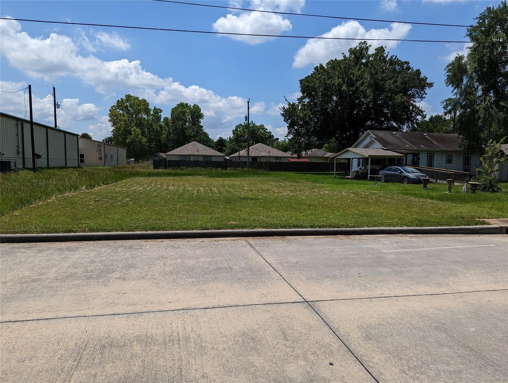 0 Mechanic Street Tomball, TX 77375 - Photo 4 of 4 a front view of a house with a yard