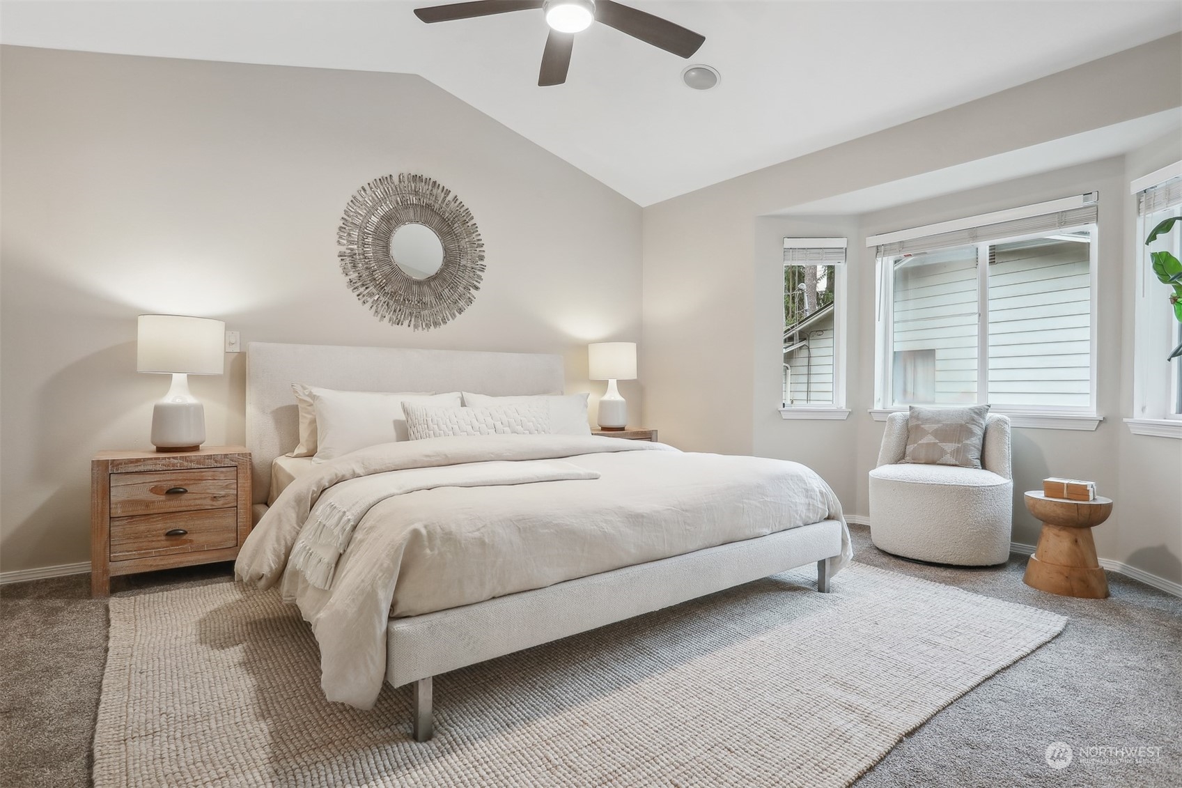 105 170th Street Southeast Bothell, WA 98012 - Photo 16 of 33 a bedroom with a large bed and ceiling fan