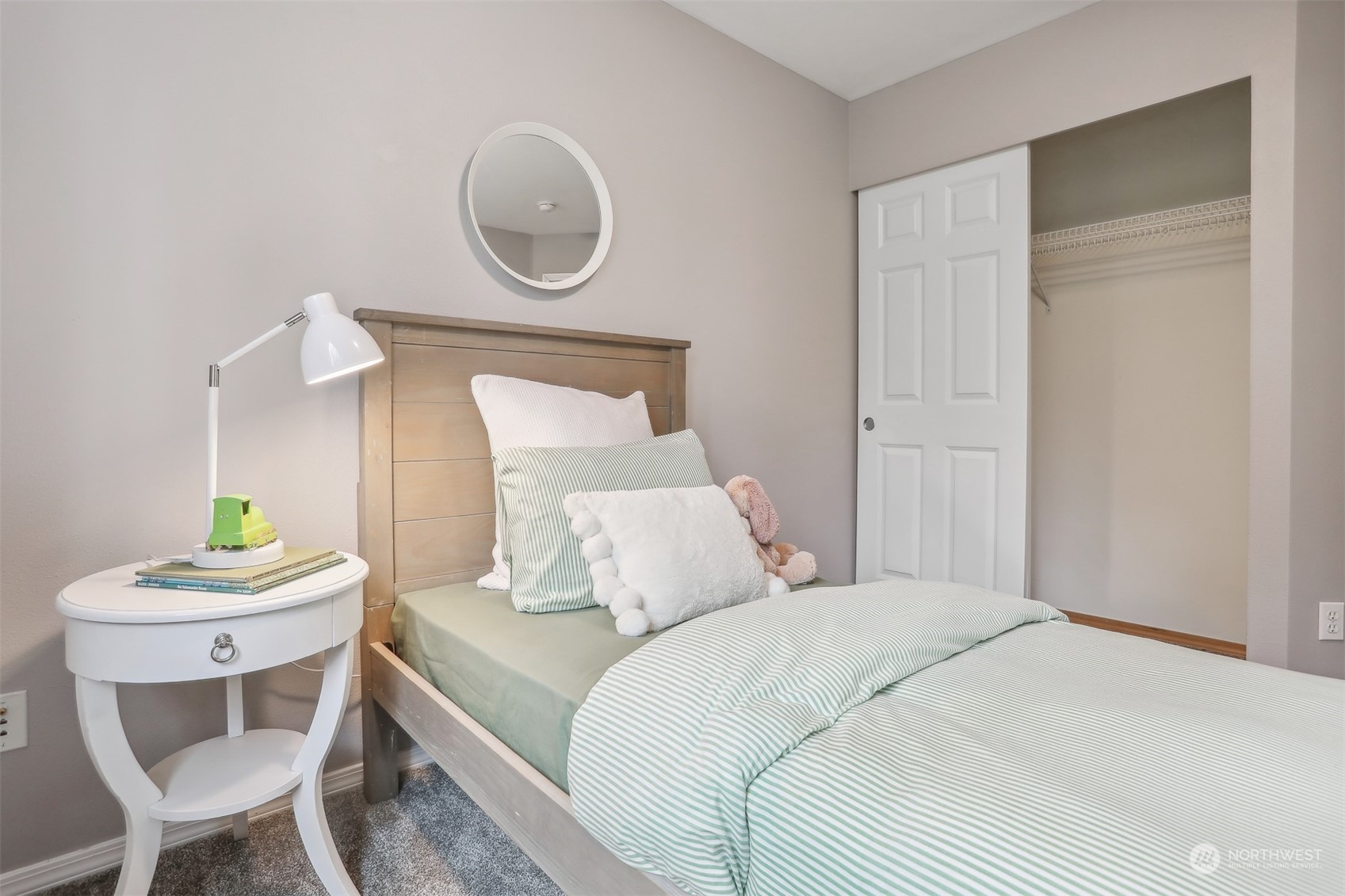 105 170th Street Southeast Bothell, WA 98012 - Photo 24 of 33 a bedroom with a bed and a mirror