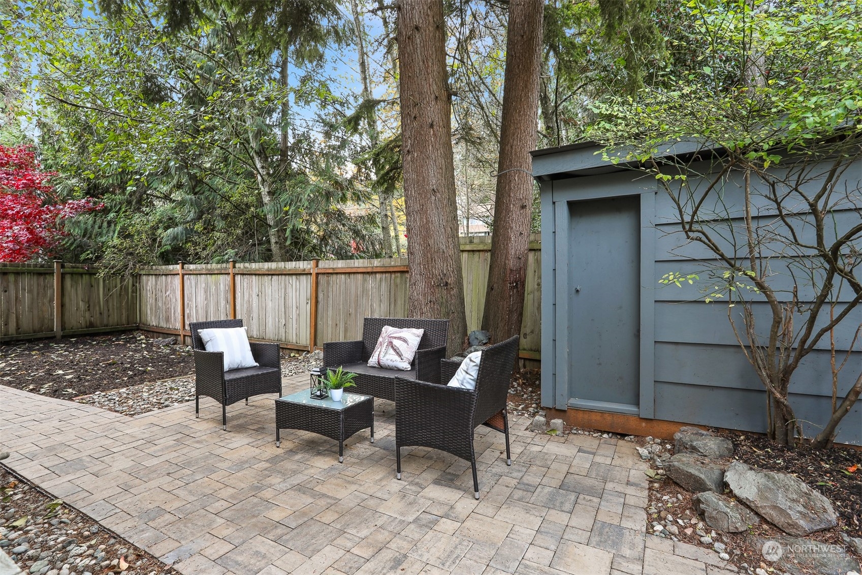105 170th Street Southeast Bothell, WA 98012 - Photo 33 of 33 a view of a patio with a table and chairs and wooden fence