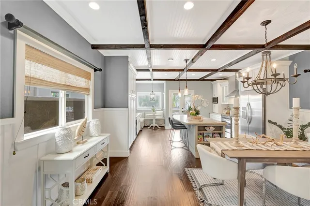 a living room with furniture wooden floor and window