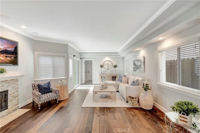 a living room with furniture large window and glass door