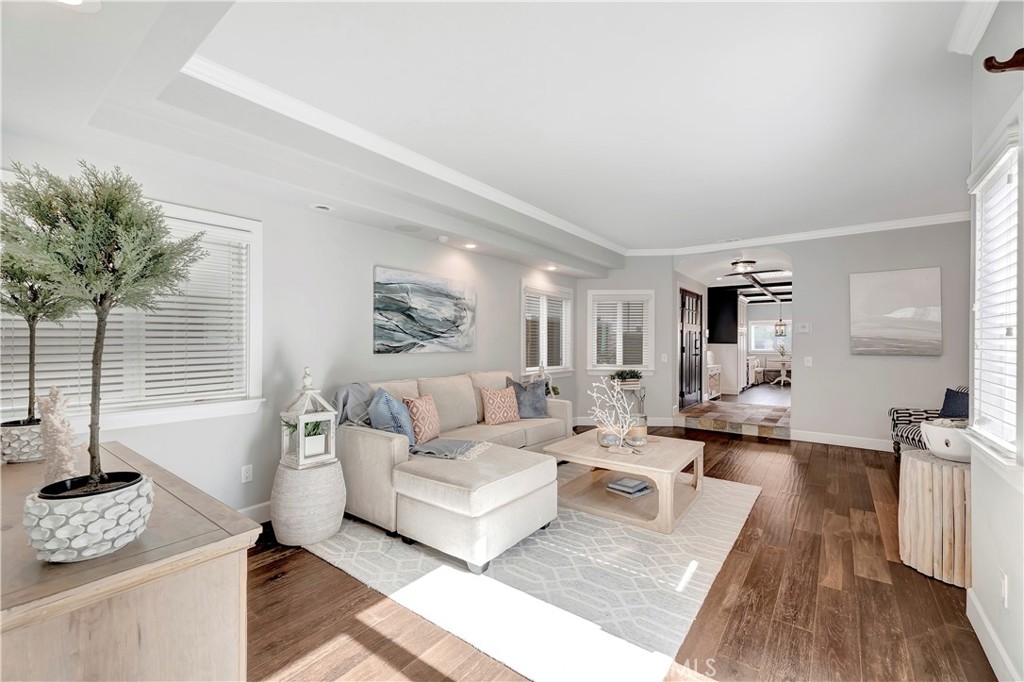 621 8th Street Huntington Beach, CA 92648 - Photo 17 of 58 a living room with furniture and a wooden floor