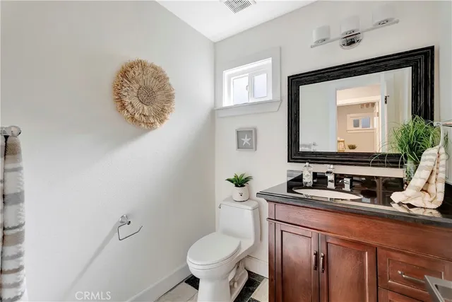 a spacious bedroom with a bed a couch and a fireplace