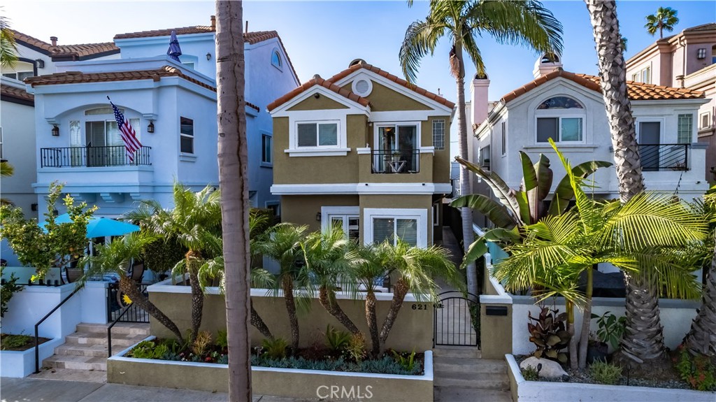 621 8th Street Huntington Beach, CA 92648 - Photo 2 of 58 a front view of a house with a garden