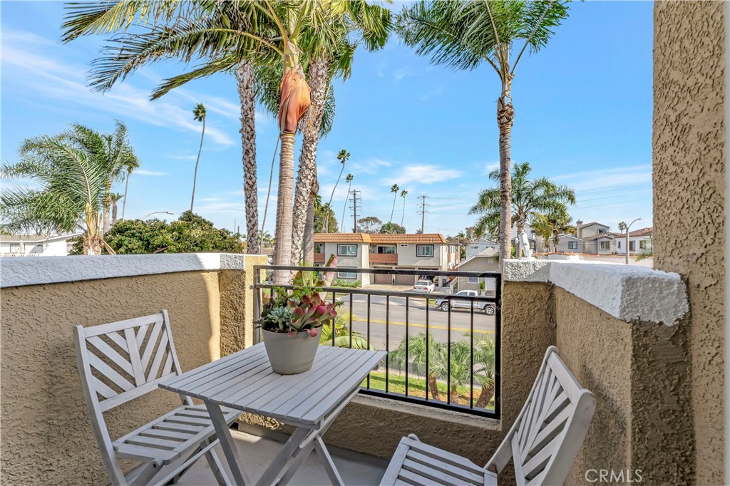 621 8th Street Huntington Beach, CA 92648 - Photo 25 of 58 a view of a balcony with two chairs and a table