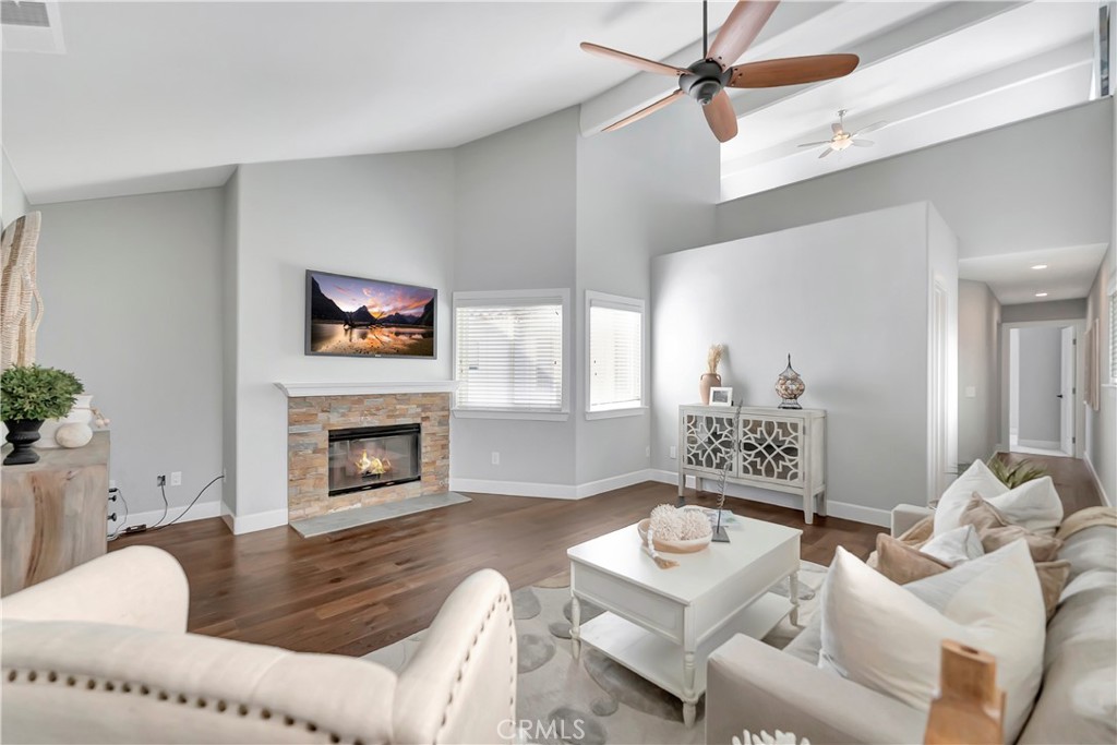 621 8th Street Huntington Beach, CA 92648 - Photo 30 of 58 a living room with furniture and a fireplace