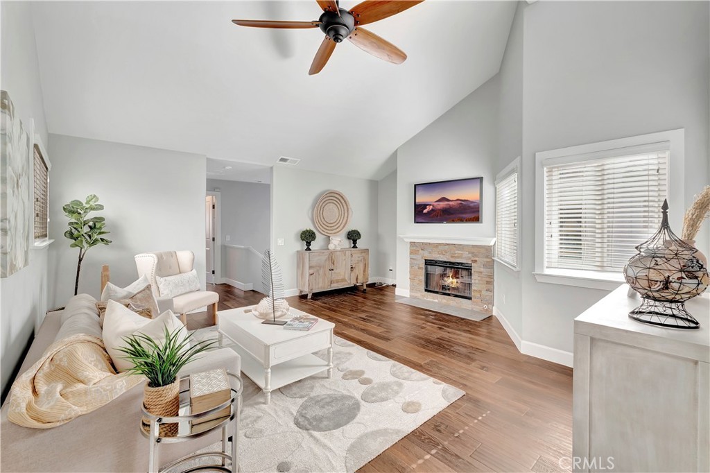 621 8th Street Huntington Beach, CA 92648 - Photo 31 of 58 a living room with furniture large window and fireplace