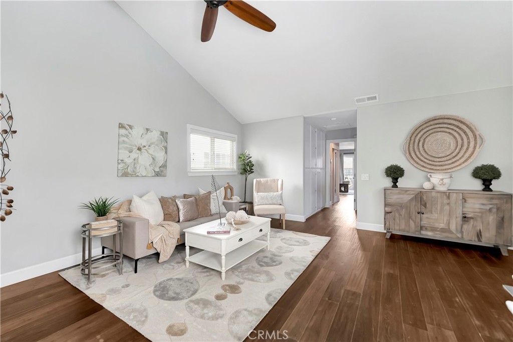 621 8th Street Huntington Beach, CA 92648 - Photo 32 of 58 a living room with furniture and wooden floor