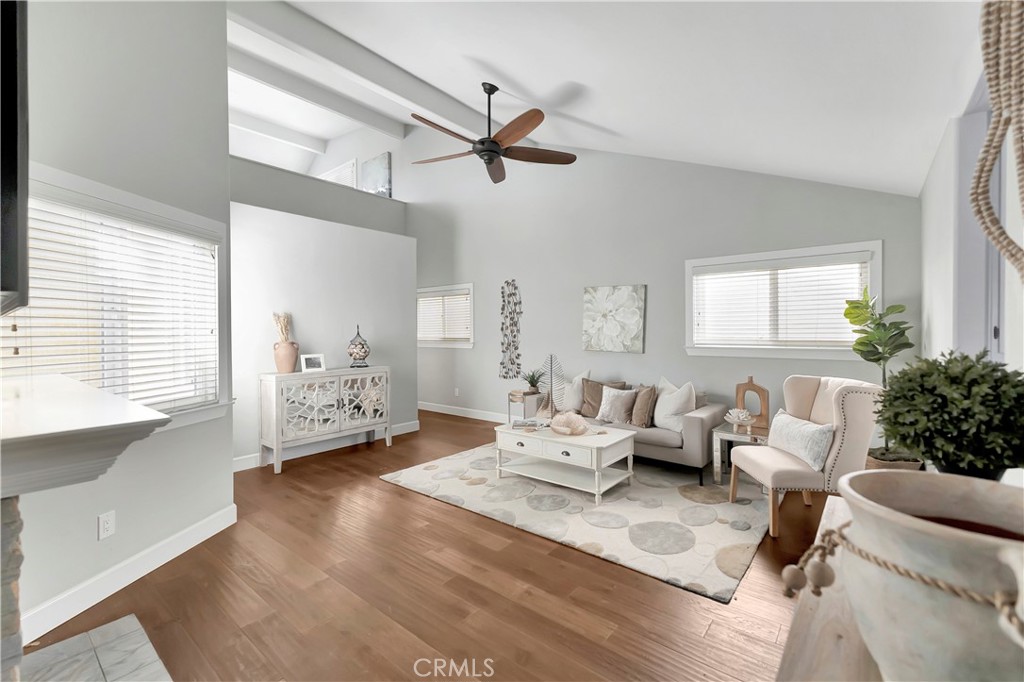 621 8th Street Huntington Beach, CA 92648 - Photo 33 of 58 a living room with furniture and wooden floor