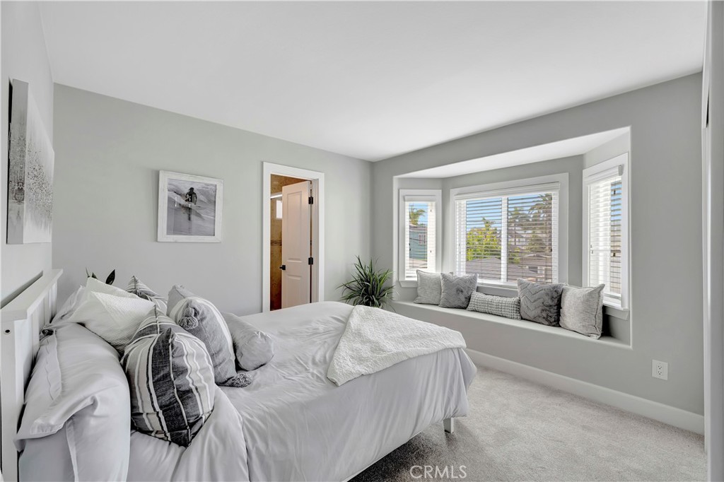621 8th Street Huntington Beach, CA 92648 - Photo 35 of 58 a living room with furniture and a large window