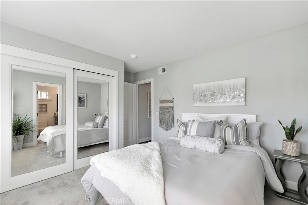 621 8th Street Huntington Beach, CA 92648 - Photo 36 of 58 a spacious bedroom with a bed and couch
