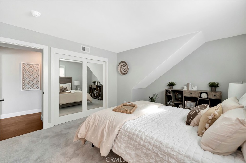 621 8th Street Huntington Beach, CA 92648 - Photo 41 of 58 a bedroom with a bed and a view of kitchen