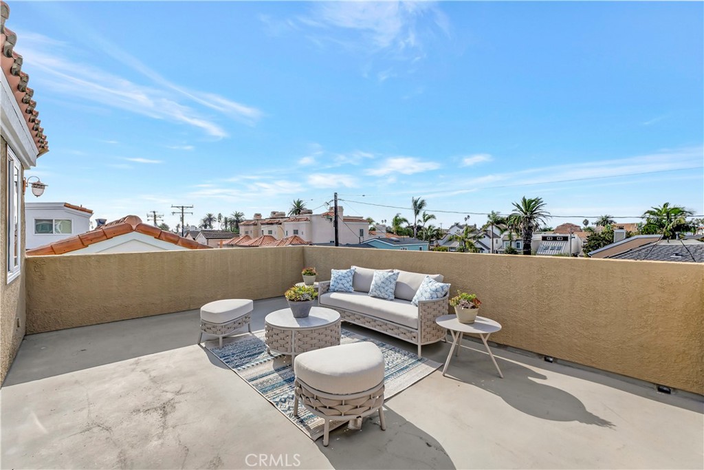 621 8th Street Huntington Beach, CA 92648 - Photo 50 of 58 a view of a terrace with furniture and a potted plant