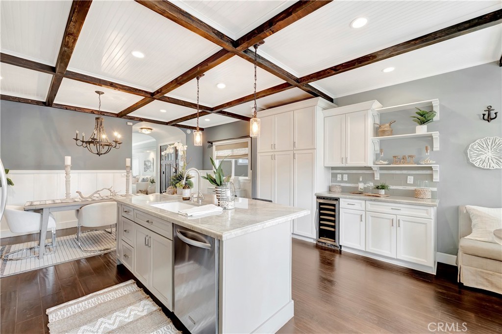 621 8th Street Huntington Beach, CA 92648 - Photo 10 of 58 a kitchen with a white cabinets and chairs