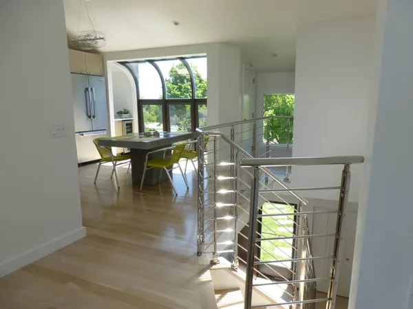 an outdoor view from a dining room with a large window