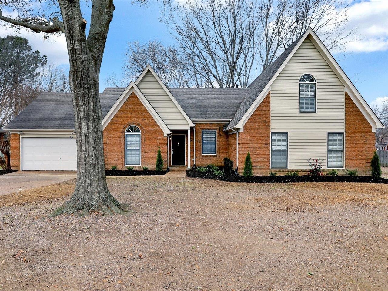 560 Fletcher Road Collierville, TN 38017 - Photo 1 of 25 a view of a house with backyard and trees