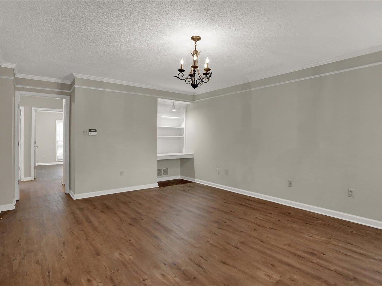 560 Fletcher Road Collierville, TN 38017 - Photo 14 of 25 wooden floor in an empty room with a window