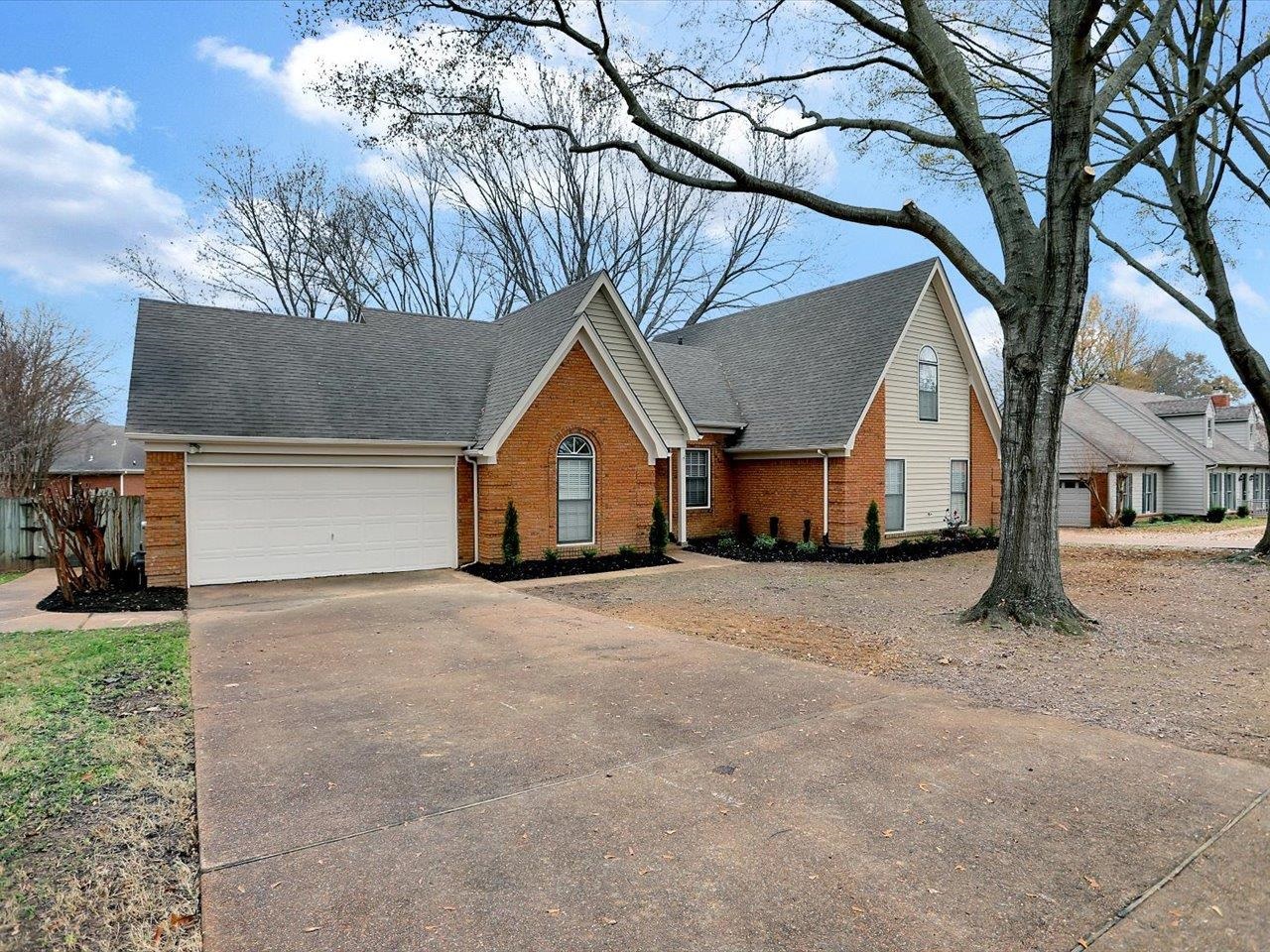 560 Fletcher Road Collierville, TN 38017 - Photo 3 of 25 a front view of a house with a yard and garage