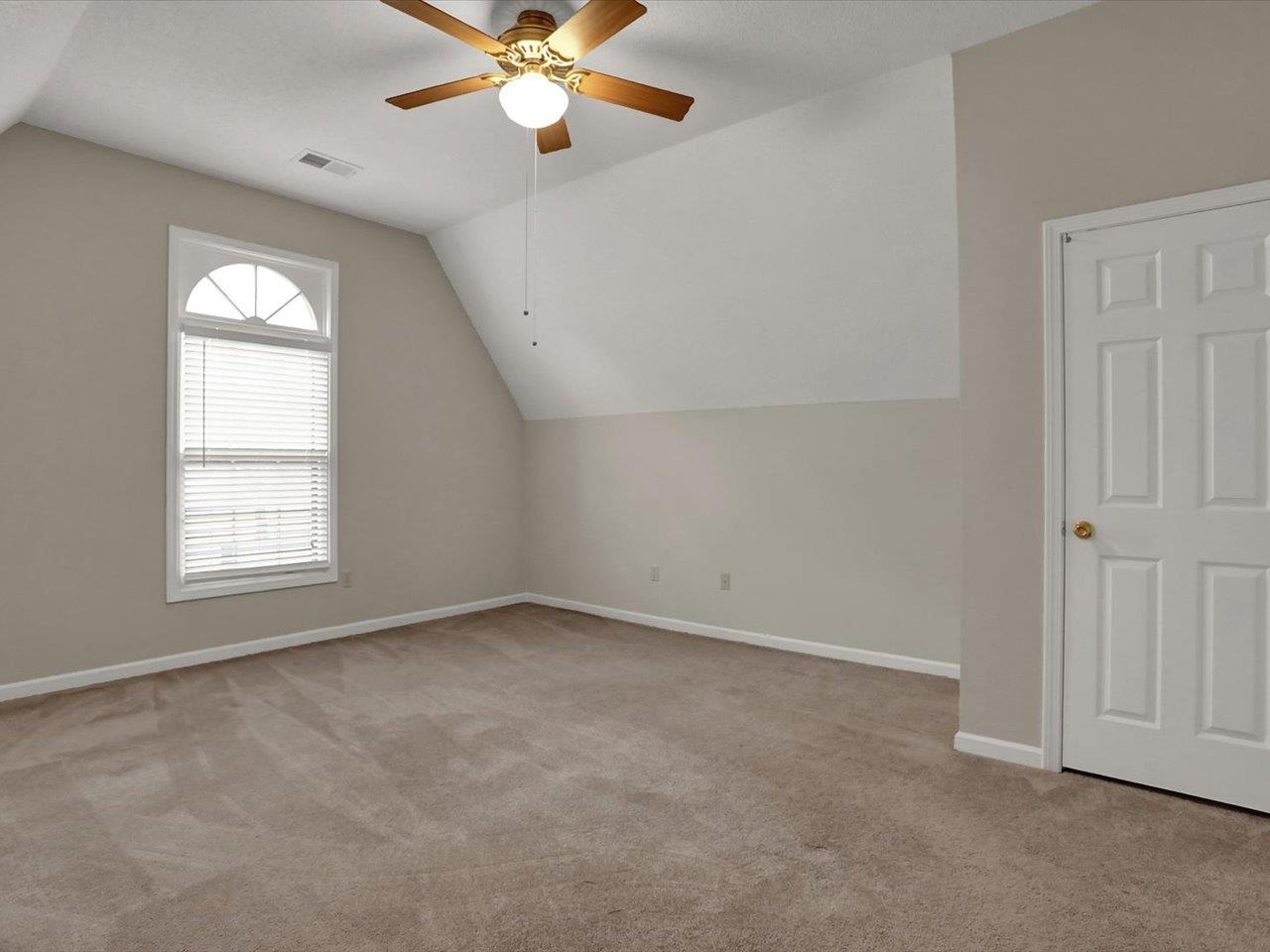 560 Fletcher Road Collierville, TN 38017 - Photo 22 of 25 an empty room with windows and fan