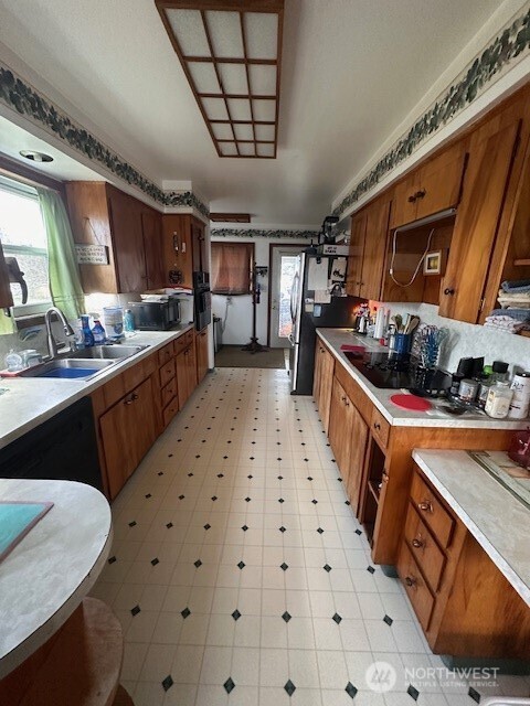 412 South 3rd Street McCleary, WA 98557 - Photo 11 of 14 a kitchen with stainless steel appliances granite countertop a sink stove and cabinets