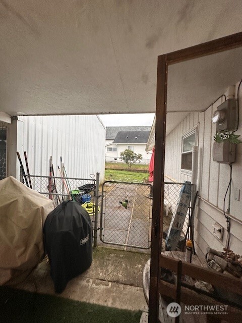 412 South 3rd Street McCleary, WA 98557 - Photo 12 of 14 a view of a living room with furniture and a floor to ceiling window