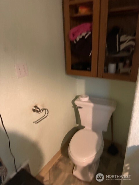 412 South 3rd Street McCleary, WA 98557 - Photo 3 of 14 a toilet sitting in a bathroom next to a sink