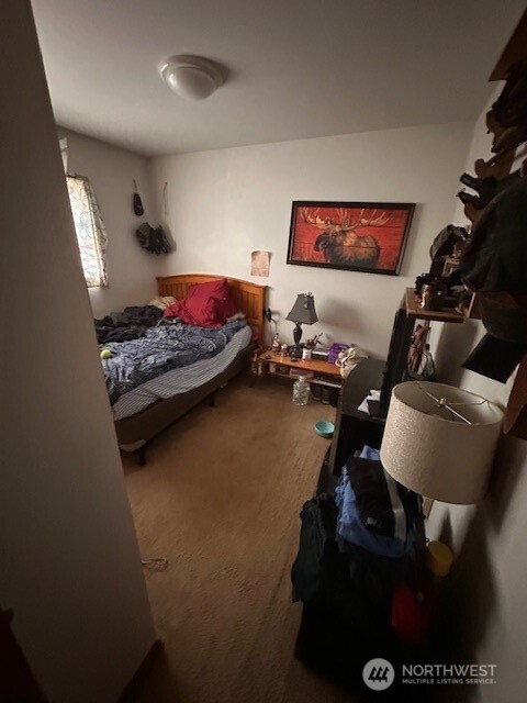 412 South 3rd Street McCleary, WA 98557 - Photo 5 of 14 a bed room with furniture and a flat screen tv