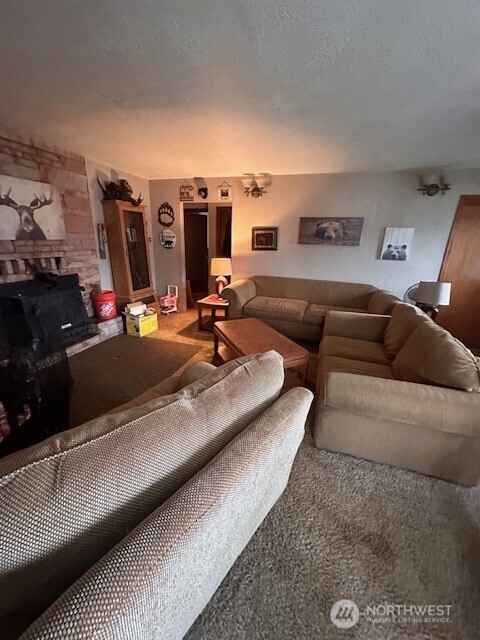 412 South 3rd Street McCleary, WA 98557 - Photo 10 of 14 a living room with furniture and a flat screen tv