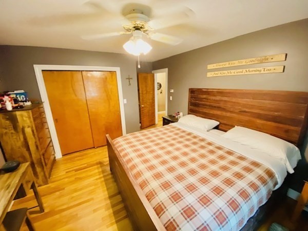 140 Valley Road Barre, MA 01005 - Photo 30 of 40 a bedroom with a bed and a chandelier