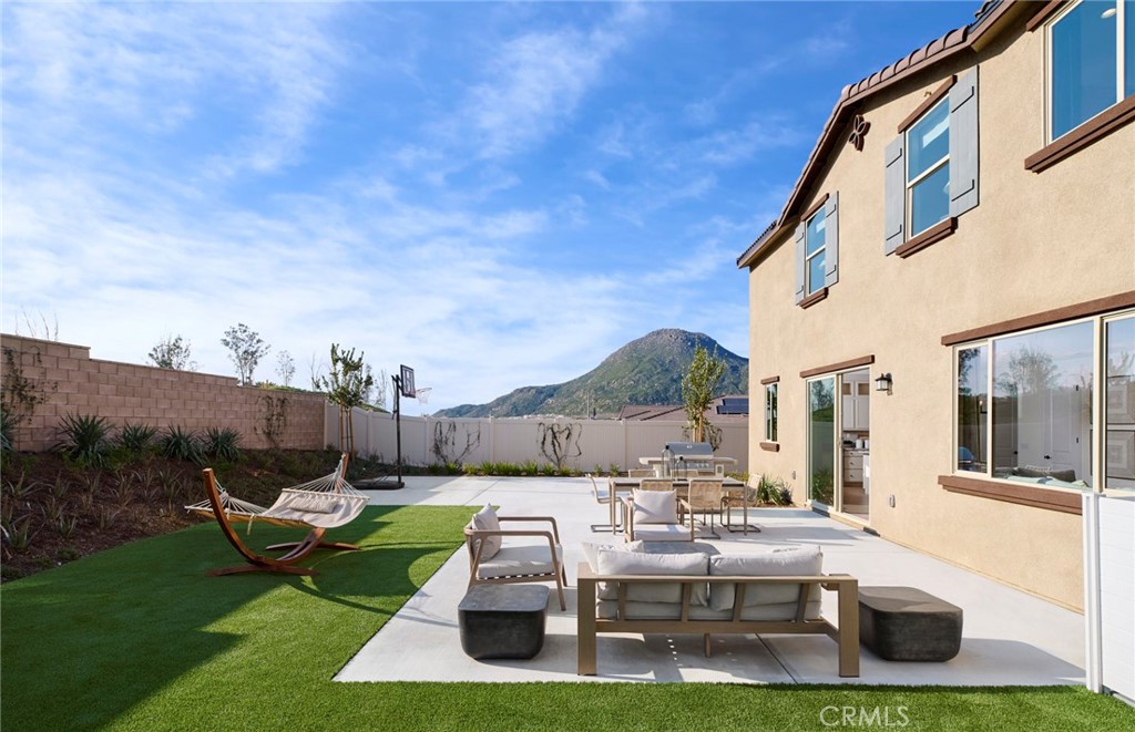 8141 Tristan Lane Riverside, CA 92507 - Photo 14 of 15 a view of backyard with outdoor seating and green space
