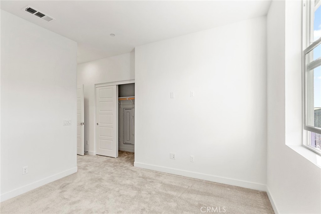234 Siena Lake Forest, CA 92630 - Photo 11 of 22 a view of an empty room with a window