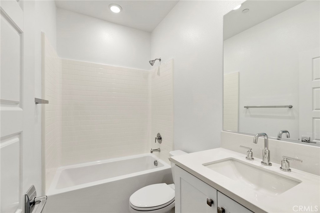 234 Siena Lake Forest, CA 92630 - Photo 12 of 22 a bathroom with a granite countertop sink toilet and shower