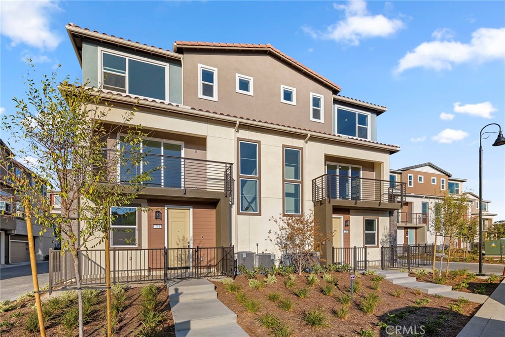234 Siena Lake Forest, CA 92630 - Photo 2 of 22 a front view of a house with a yard