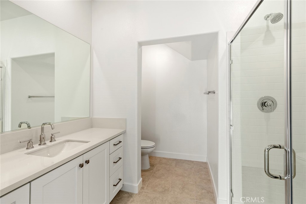 234 Siena Lake Forest, CA 92630 - Photo 5 of 22 a bathroom with a double vanity sink toilet and shower