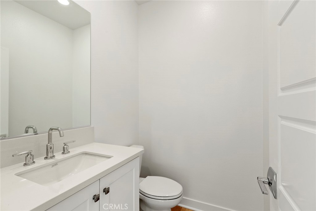 234 Siena Lake Forest, CA 92630 - Photo 9 of 22 a bathroom with a sink a toilet and vanity