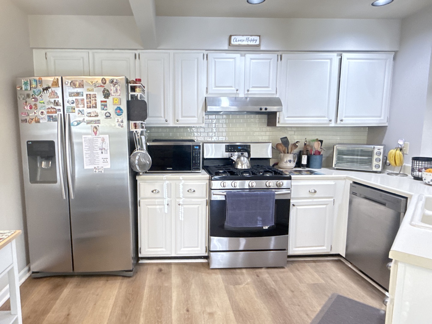 256 Haber Court Cary, IL 60013 - Photo 6 of 18 a kitchen with stainless steel appliances a refrigerator stove and white cabinets