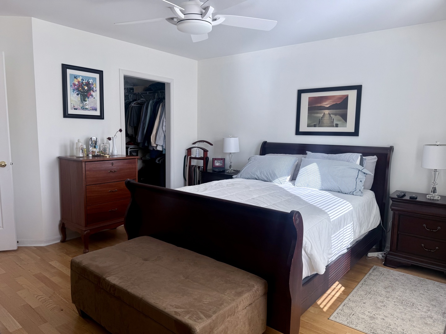 256 Haber Court Cary, IL 60013 - Photo 8 of 18 a bedroom with a bed and a chandelier